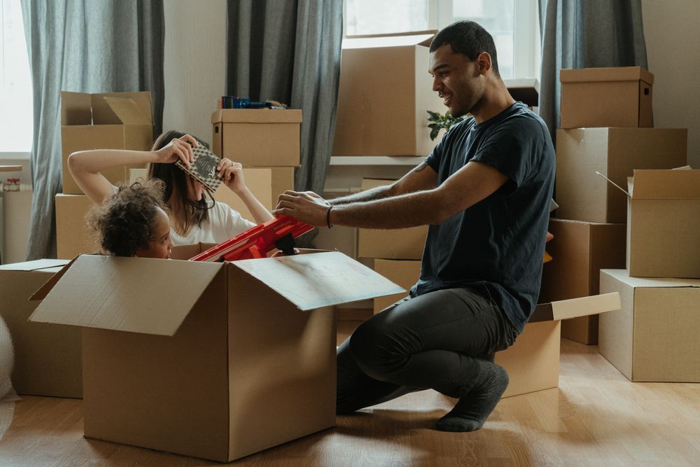 Family with moving boxes