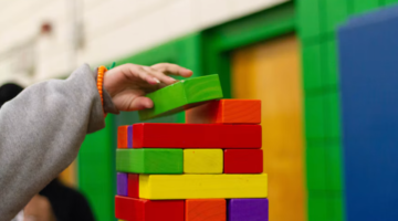 kid stacking blocks