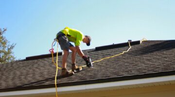 man working on roof