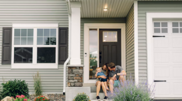 new family in front of home