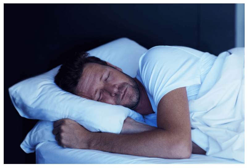 man sleeping on pillow