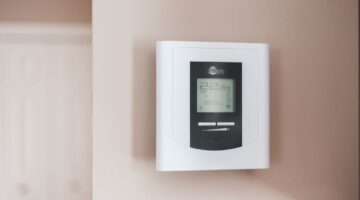 white thermostat on the wall