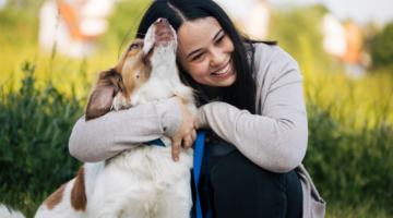 woman hugging dog