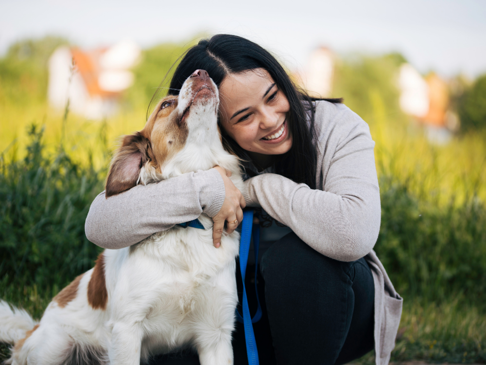 woman hugging dog